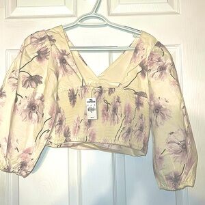 BRAND express. selling Two crop top floral, long sleeve size small &extra small.